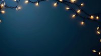 Glowing string lights creating festive border against dark blue background, soft bokeh effect adds magical ambiance for holiday and celebration designs.