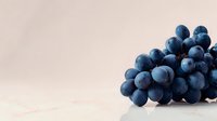 Fresh dark blue grapes cluster on light background for healthy eating and nutrition concepts in food photography and culinary design projects.