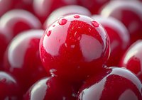 Fresh ripe red cranberries with water drops in macro view showing glossy surface texture and natural organic appearance. Perfect for food and harvest themes.