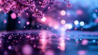 Dreamy spring landscape with cherry blossom petals falling on water surface at dusk, magical purple and blue bokeh lights creating romantic atmosphere.