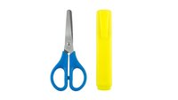 Young student using blue scissors and yellow highlighter marker for school art project and creative learning activities.