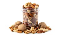 Mixed nuts assortment in glass jar with scattered almonds walnuts pecans cashews hazelnuts on white background isolated for healthy snacking designs.
