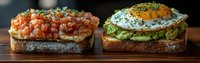 Gourmet open-faced sandwiches with salmon tartare and avocado topped with fried egg on rustic bread, served on wooden board.