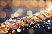 Golden glitter and bokeh lights create magical festive atmosphere in macro shot with shallow depth of field, sparkling holiday background with copy space.