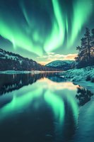 Spectacular aurora borealis dancing over frozen lake with snow-covered mountains and forest reflection in winter landscape for nature photography projects.