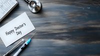 Medical stethoscope, syringe and greeting card on dark wooden background with copy space, top view composition for healthcare celebration.