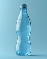 Clear plastic water bottle with condensation droplets on blue background for beverage marketing and hydration concepts.