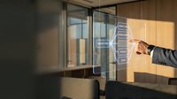 Businessman touching futuristic holographic interface with digital data panels in modern office environment for technology and innovation concepts.