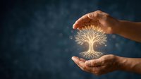 Hands holding glowing tree of life symbol against dark blue background, representing growth, knowledge, spirituality, and environmental care for wellness and nature concepts.