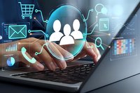Businessman hands typing on laptop with digital customer service icons and team management interface for online business solutions.