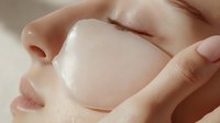 Close-up view of smooth facial skin with hydrating under-eye patch treatment showing skincare and beauty routine for cosmetic product advertising.