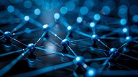 Glowing blue network nodes connected by illuminated lines create futuristic technology visualization on dark background, representing digital connectivity.