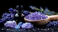 Purple bath salt crystals in wooden spoon with essential oil bottle, lavender flowers and amethyst stones on dark background for spa and wellness concept.