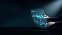 Businessman holding transparent laptop displaying glowing financial charts and data analytics graphs for business intelligence, investment analysis, and digital technology concepts.