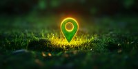 Glowing green location pin marker floating over grass at night with magical light effect and bokeh. Concept for GPS navigation and location services.