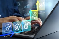 Business professional using laptop with digital innovation icons and data analytics interface for strategic planning and goal achievement.
