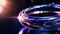 Glowing spiral light trails with vibrant blue, purple and orange colors against dark background create dynamic motion effect for technology and innovation designs.