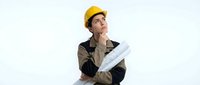 Male construction worker wearing yellow hard hat and work clothes holding blueprints, looking upward thoughtfully on white background. For design, construction, and business projects.