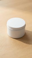 White round cosmetic jar container on wooden surface for skincare cream lotion product packaging mockup branding design.