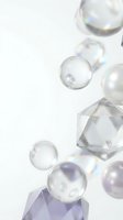 Transparent soap bubbles and crystal geometric shapes floating on white background with rainbow reflections and iridescent light effects for design projects.