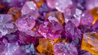 Vibrant amethyst and citrine crystal clusters in macro view showing natural formations with purple and amber hues, raw mineral texture and light reflections.
