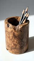 Rustic wooden pencil holder with natural grain patterns holds sharpened graphite pencils, ideal for desk organization, art studios, and creative workspace styling.
