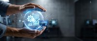 Businessman hands holding glowing digital gear and chart icons representing business analytics, data management, and industrial technology solutions.