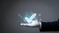 Business hand presenting glowing checkmark symbol representing approval, success, and quality assurance for corporate presentations and marketing materials.