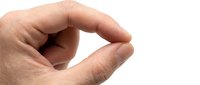 Close-up of a hand making a small gesture with thumb and forefinger, isolated on white background, suitable for design projects and educational materials.