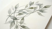 Delicate watercolor eucalyptus branch with soft green leaves on textured paper, botanical illustration for wedding invitations and natural design projects.