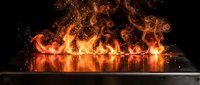 Digital tablet screen erupting with intense flames and sparks against dark background for technology concepts and dramatic visual effects.