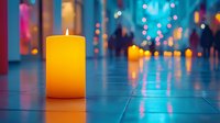 Glowing yellow candle on reflective floor with blurred bokeh lights creating atmospheric mood. Peaceful meditation and spa wellness background.