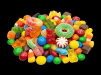 Colorful mixed candy pile with gummy bears, sugar rings, chocolate drops, and peppermint sweets, isolated on transparent background, ready for stickers, clipart, and print on demand.