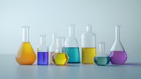 Laboratory glassware filled with colorful liquids in orange, purple, yellow, blue, and green arranged in row on light background, scientific research concept.