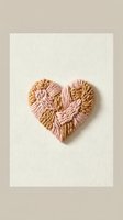 Handmade macrame heart in pink and beige rope on neutral background for Valentine's Day crafts and romantic home decor projects.