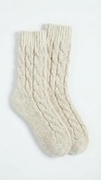 Cozy cable knit wool socks in neutral beige, isolated on white background, ready for design use in fashion and lifestyle projects.