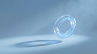 Transparent glass ring floating above reflective surface in soft blue light, suitable for cosmetics, skincare, and product packaging design.