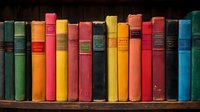 Row of vintage multicolored hardcover books arranged on wooden shelf, showing weathered spines in vibrant shades of red, yellow, blue, and green against dark background.