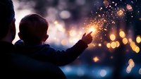 Parent and child silhouette watching sparklers against blurred bokeh lights background creating magical evening atmosphere during celebration or holiday.