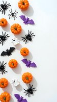 Halloween decorations with orange pumpkins, black spiders, purple bats and white ghosts scattered on white background for seasonal party planning.