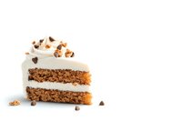 Slice of layered carrot cake with cream cheese frosting, topped with chopped walnuts and chocolate chips on white background, isolated for menu design.