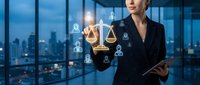 Professional businesswoman in dark suit holding digital tablet with glowing justice scales and legal icons in modern office overlooking city skyline at dusk.