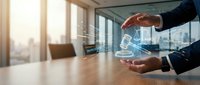 Businessman holding glowing digital gavel and scales of justice hologram in modern office, symbolizing legal technology and online justice.