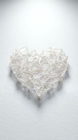 White wire heart sculpture with geometric network pattern and beads on neutral background for romantic decor and craft projects.