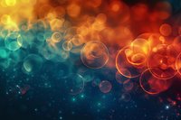 Abstract colorful bokeh background with magical glowing circles in orange and turquoise tones, perfect for festive designs, holiday cards, and creative digital projects.