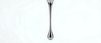Metallic water droplet suspended in mid-air against white background, isolated design element suitable for web, print, and product packaging applications.