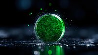 Glowing green circuit pattern in round glass container with luminous particles against dark background, creating futuristic technological atmosphere.