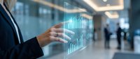 Young professional in business suit interacting with holographic data visualization displaying financial charts and graphs in modern corporate office environment.