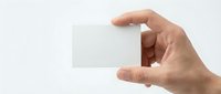 Hand holding blank transparent glass card mockup on white background for business presentation and branding design projects.