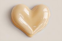 Golden honey-colored heart shape with glossy finish on neutral background for romantic designs, wellness branding, and love-themed projects.
